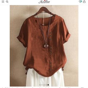 Women’s cotton/linen rust colored top with button embellishments. Size XL